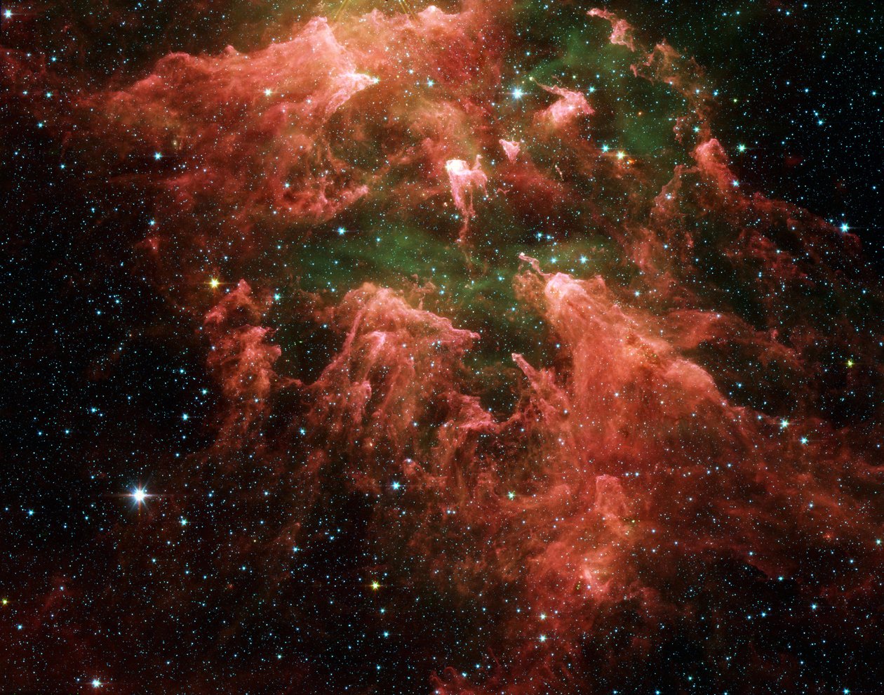 Spitzer-Weltraumteleskop-Falschfarbenbild der Südpfeilerregion der sternbildenden Region namens Carina-Nebel. Sternembryonen (gelb oder weiß) in fingerartigen Säulen aus dickem Staub (rosa). Heiße Gase. von National Aeronautics and Space Administration National Aeronautics and Space Administration