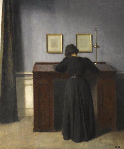 Ida steht an einem Schreibtisch, 1900 von Vilhelm Hammershoi